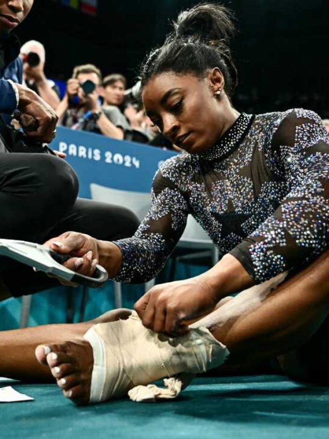 Simone Biles hurts her leg in Olympic gymnastics qualifying but finishes 1st anyway